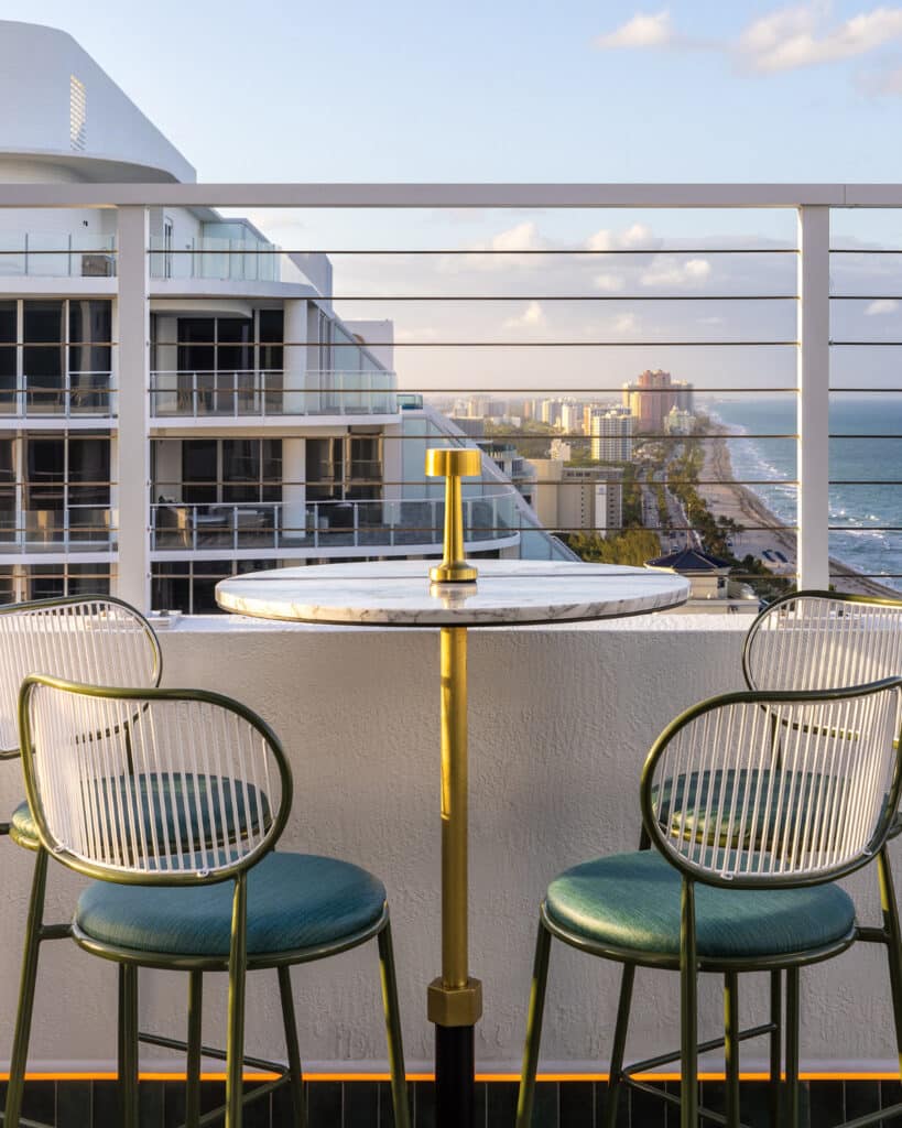 Nube dining table for two overlooking the ocean