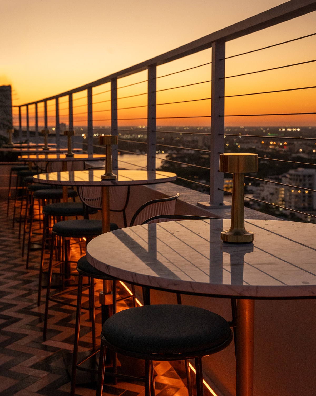 Nube rooftop during sunset overlooking the city